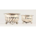 A SMALL PAIR OF VICTORIAN SILVER SALTS. Birmingham 1888.