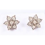 A PAIR OF 9CT GOLD AND DIAMOND FLOWER HEAD CLUSTER EARRINGS.