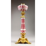 A GOOD 19TH CENTURY FRENCH ORMOLU AND PINK OVERLAY OIL LAMP. 22ins high.