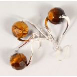 A SILVER AND TIGER'S EYE PENDANT AND EARRING SET.