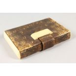 AN ART DECO SNAKESKIN AND IVORY COMPACT.