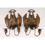 A PAIR OF UNUSUAL TWIN BRANCH WALL LIGHTS, modelled as bats hanging upside down. 11ins high.