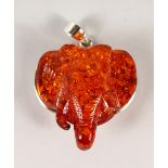 A SILVER AND AMBER PENDANT.