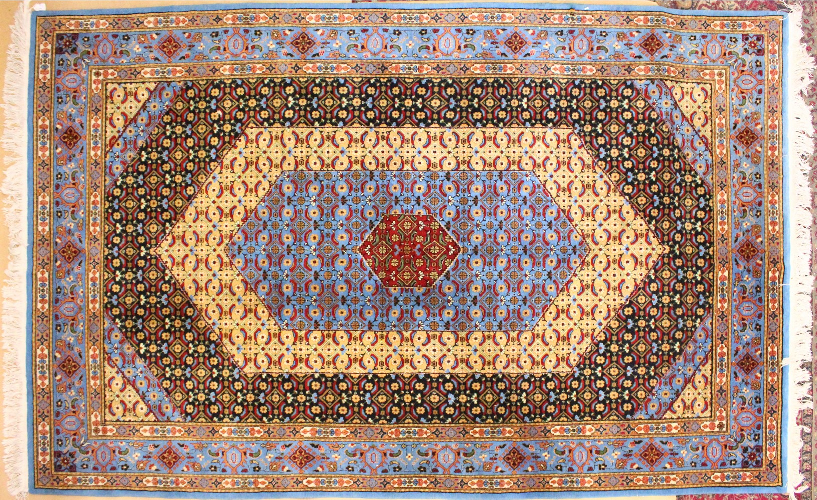 A PERSIAN SMALL CARPET, pale blue ground with central medallion and floral decoration. 9ft 5ins x