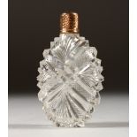 A GOLD AND CUT GLASS SCENT BOTTLE.