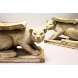 A GOOD PAIR OF CARVED AND PAINTED PANTHER SEATS on rectangular bases. 2ft 6ins long.