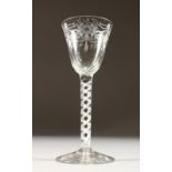AN 18TH CENTURY WINE GLASS, with floral engraved moulded bowl, and an air twist stem. 6ins high.