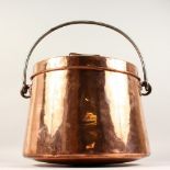 A LARGE 19TH CENTURY COPPER COOKING POT, with lid and wrought iron handle. 16ins wide x 15ins high.