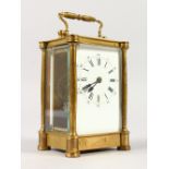 A FRENCH BRASS CARRIAGE CLOCK. 4.5ins high.