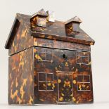 A FAUX TORTOISESHELL COTTAGE SHAPED TEA CADDY. 6.5ins wide.