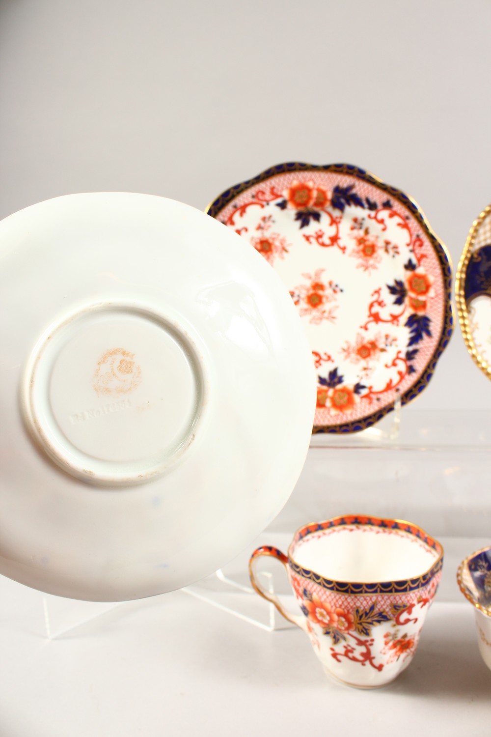 A COALPORT TRIO AND A HAMMERSLEY TRIO, blue and gilt painted with roses. - Image 4 of 7