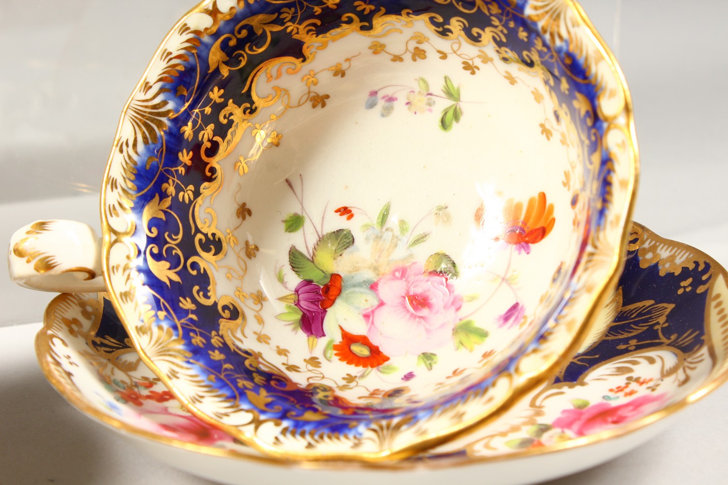 TWO COALPORT PORCELAIN TRIOS, blue and gilt decorated with roses. - Image 4 of 7