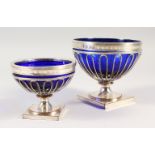 AN OLD SHEFFIELD PLATE PEDESTAL SUGAR BOWL, with blue glass liner and similar smaller bowl. 5ins and
