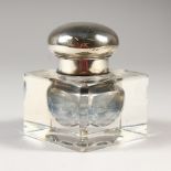 A SQUARE CUT GLASS INKWELL with hinged top. 3ins wide.