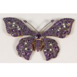 A 9CT GOLD AND SILVER SET AMETHYST AND DIAMOND BUTTERFLY BROOCH.