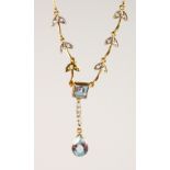 A 9CT GOLD BLUE TOPAZ AND DIAMOND NECKLACE.