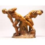 A VERY GOOD 19TH CENTURY CARVED WALNUT GROUP OF TWO NAKED STRONG MEN, posed either side of a tree