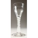 A GEORGIAN WINE GLASS, with cotton twist stem and fluted bowl. 5ins high.