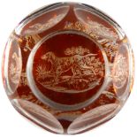 A BOHEMIAN FACETED PAPERWEIGHT with dogs. 3ins.