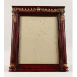 A CLASSICAL STYLE CARVED WOOD PHOTOGRAPH FRAME. 12in high x 10ins wide.