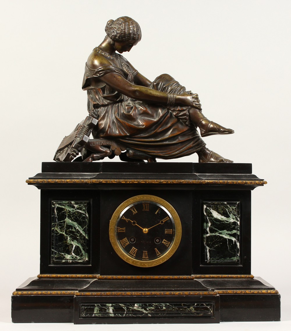 A LATE 19TH CENTURY FRENCH MARBLE MANTLE CLOCK, with eight day movement, striking on a bell, the
