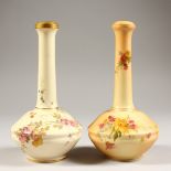 TWO ROYAL WORCESTER BLUSH IVORY BUD VASES, No. 1531 each painted with flowers. 7ins high.