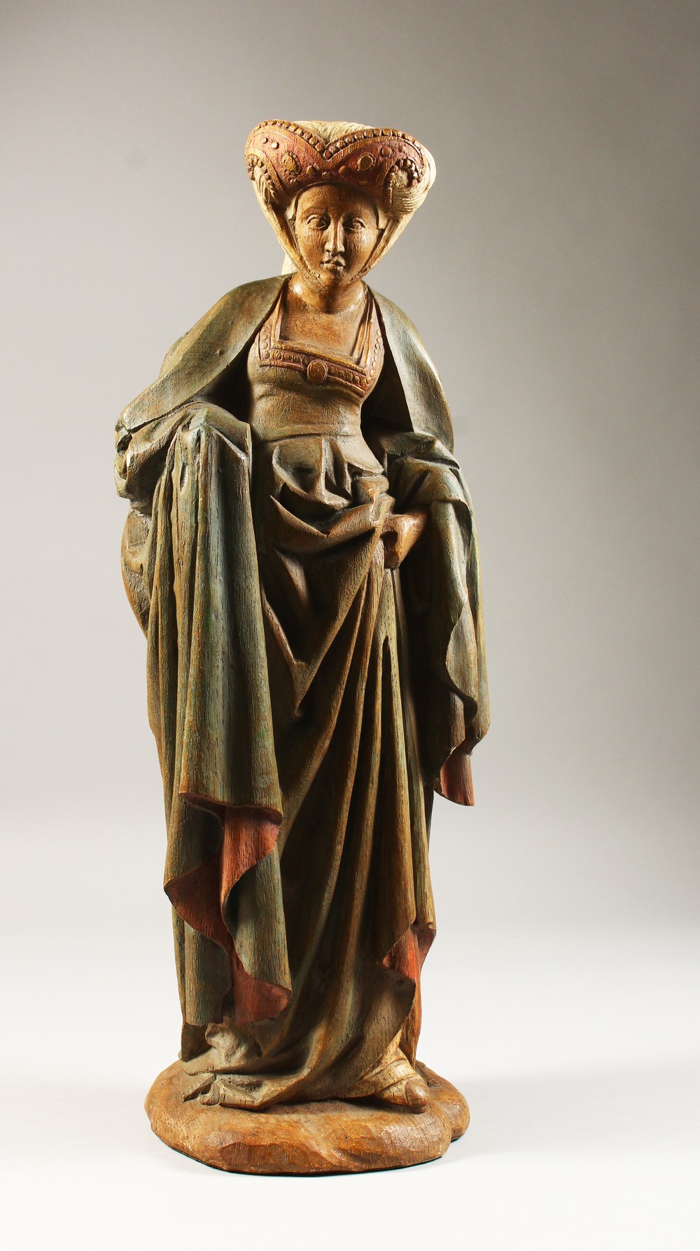 A PAINTED TERRACOTTA MODEL OF A MEDIEVAL LADY, 20th Century. 22ins high.