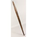 A CARVED WOOD SPEAR / THROWING CLUB. 35ins long.