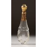 A GOLD AND CUT GLASS SCENT BOTTLE.