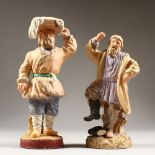 A PAIR OF 19TH CENTURY RUSSIAN PORCELAIN FIGURES by GARDNER of a man dancing, the other with a