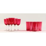 A SET OF NINE CRANBERRY GLASS SMALL TUMBLERS, together with five cranberry wine glasses (14).