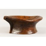 AN EARLY CARVED FRUITWOOD MORTAR. 11ins wide x 4.5ins high.