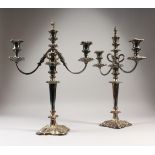 A PAIR OF SHEFFIELD PLATE THREE LIGHT, TWO BRANCH CANDELABRA. 20ins high.