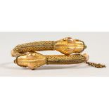 A VICTORIAN GOLD-PLATE SNAKE BRACELET.