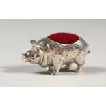 A NOVELTY SILVER PIG PIN CUSHION.