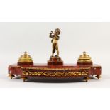 A GOOD FRENCH MARBLE AND ORMOLU INKSTAND with two ink bottles and cupid as a seal. 13ins long.