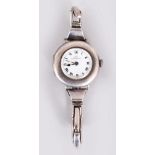 AN EDWARDIAN LADIES SILVER SCHAFFHAUSEN INTERNATIONAL WATCH CO. WRISTWATCH.