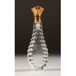 A GOLD AND CUT GLASS SCENT BOTTLE.