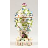 A CONTINENTAL PORCELAIN POT POURRI VASE AND COVER, floral encrusted decoration on three scroll