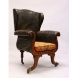 A GOOD 19TH CENTURY MAHOGANY FRAMED WING ARMCHAIR, the showwood frame having scrolling arms, curving