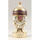 A CONTINENTAL PORCELAIN POT POURRI VASE AND COVER, with floral painted decoration, on three scroll