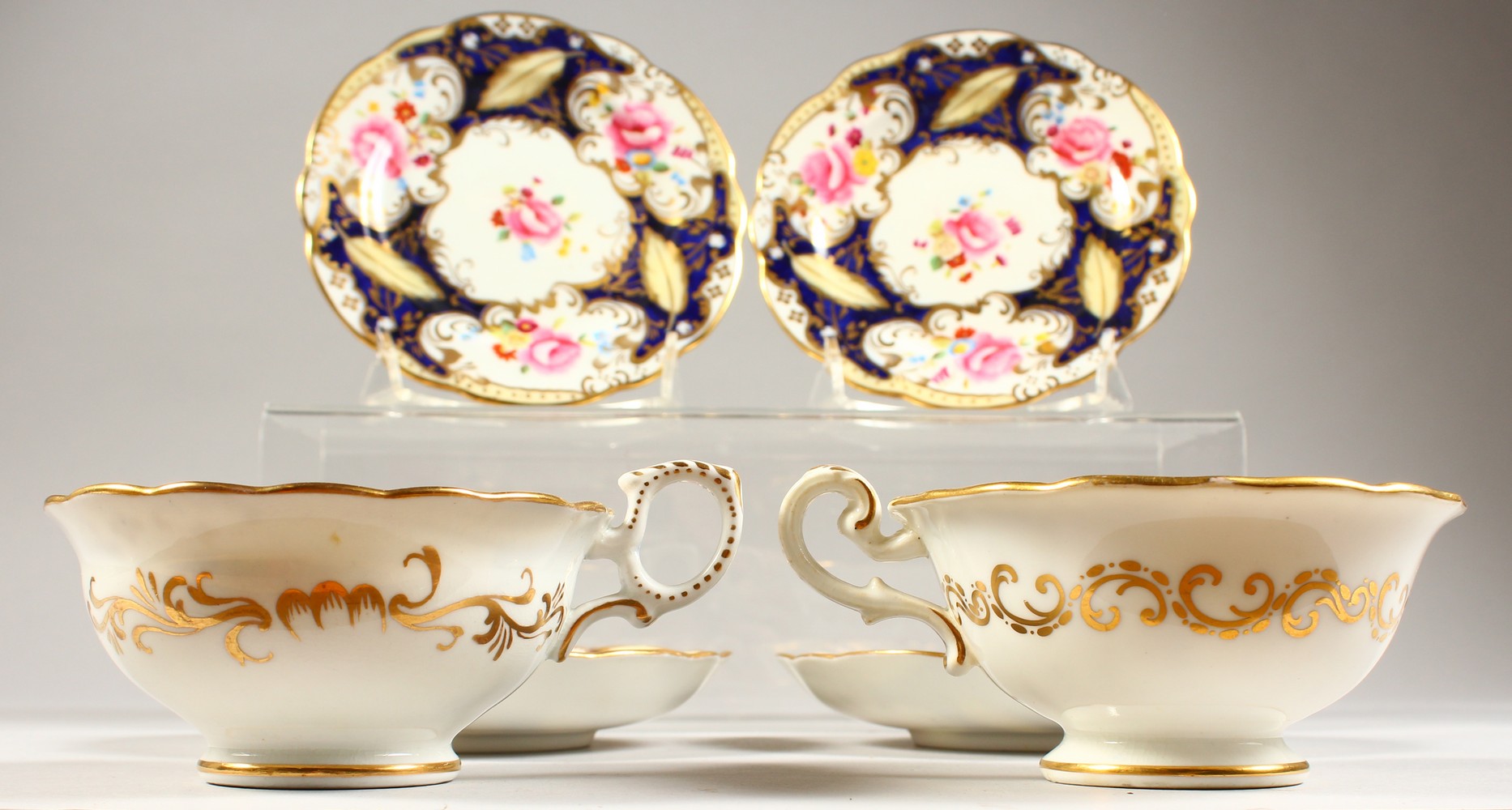 TWO COALPORT PORCELAIN TRIOS, blue and gilt decorated with roses. - Image 5 of 7