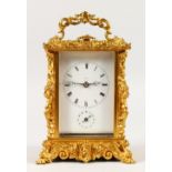 A GOOD 19TH CENTURY FRENCH ORMOLU CARRIAGE CLOCK in an ornate case with repeat action and alarm.