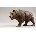 A BLACK FOREST CARVED BEAR. 9ins long.