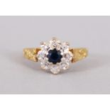 AN 18CT GOLD AND SAPPHIRE RING.