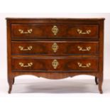 A LOUIS XVTH STYLE WALNUT SERPENTINE FRONTED COMMODE, late 19th Century, with three long drawers