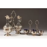 A CONTINENTAL SILVER OIL AND VINEGAR BOTTLE STAND, with two cut glass bottles with silver mounts,