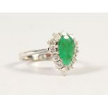 AN 18CT WHITE GOLD, DIAMOND AND EMERALD PEAR SHAPE RING.