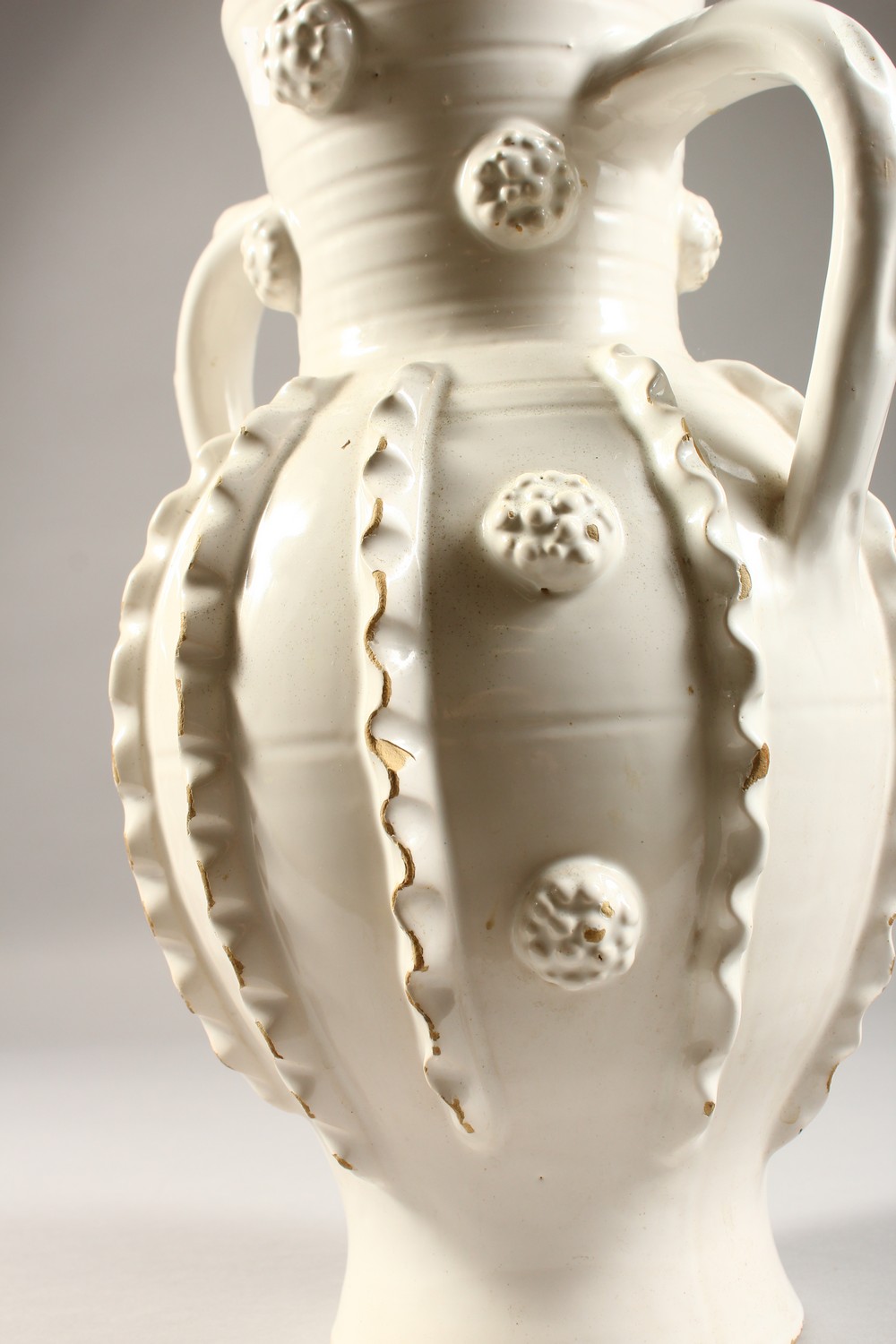 A 20TH CENTURY CONTINENTAL WHITE GLAZED TWIN HANDLED EARTHENWARE VASE, with ribbed decoration. 13ins - Image 6 of 10