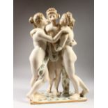 A POTTERY GROUP "THE THREE GRACES". 18.5ins high.